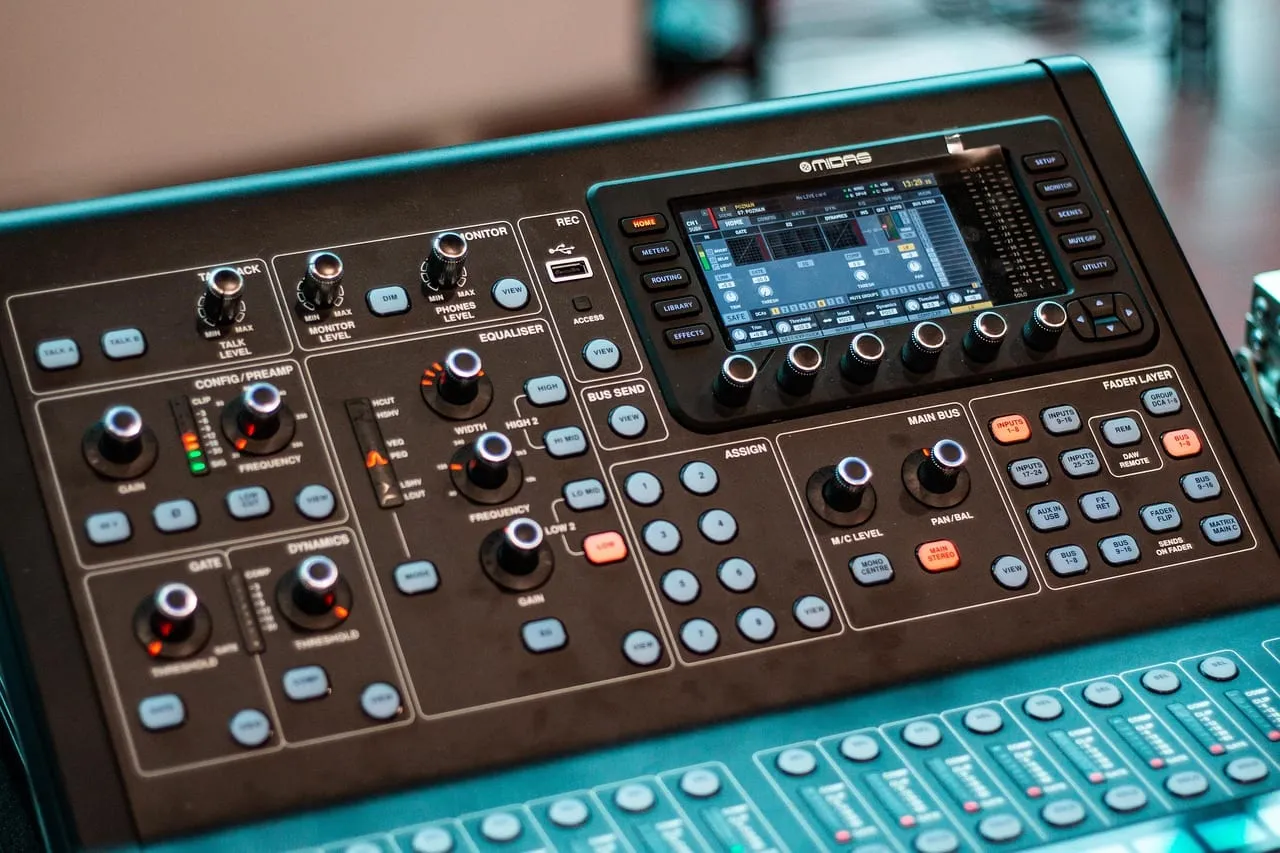 Photo showing audio mixer, console and control panel.