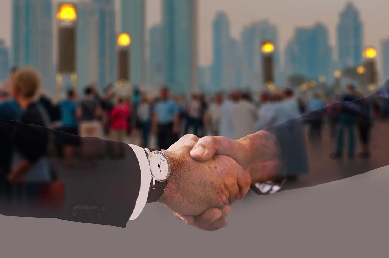 Photo showing handshake, shaking hands, men’s suit and politician.