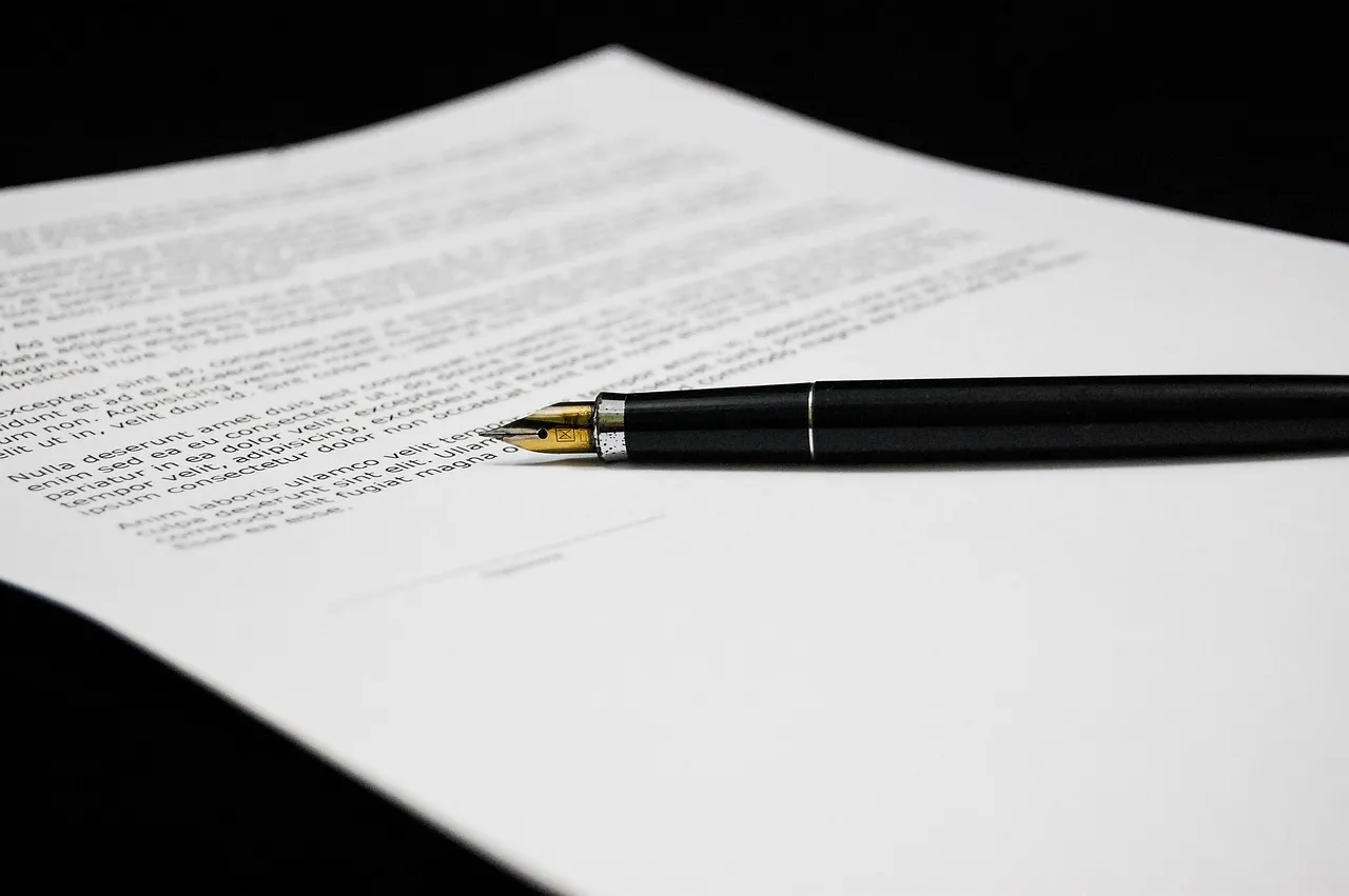 Photo showing document, agreement, documents and sign.