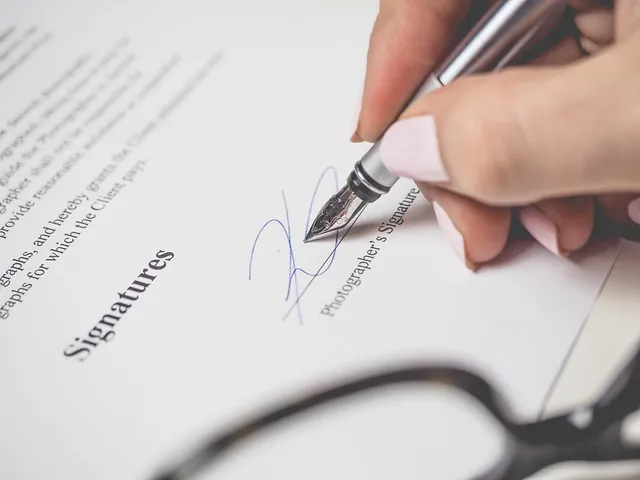 Photo showing penmanship, pen and signature.