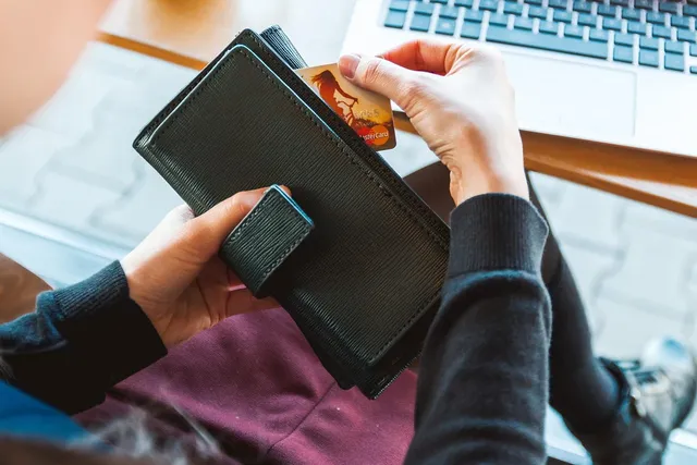 Photo showing wallet, money and credit card.
