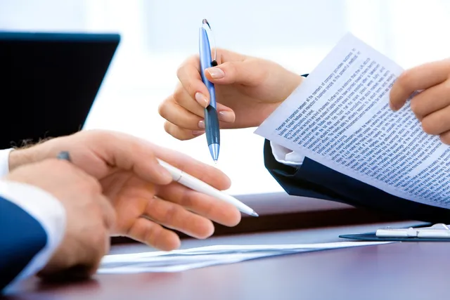 Photo showing laptop, office and hand.