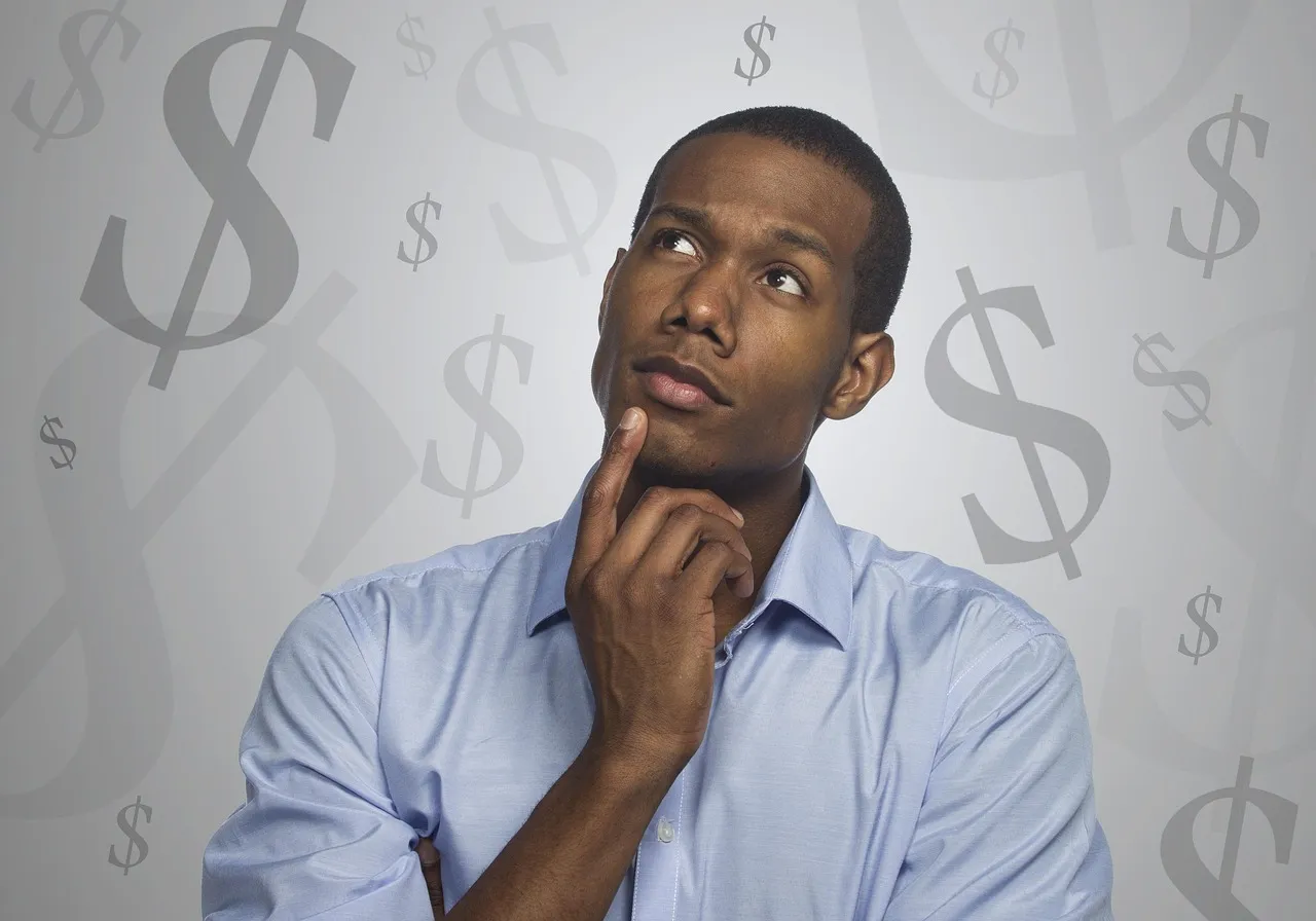 Photo showing man, thinking, money and debt.