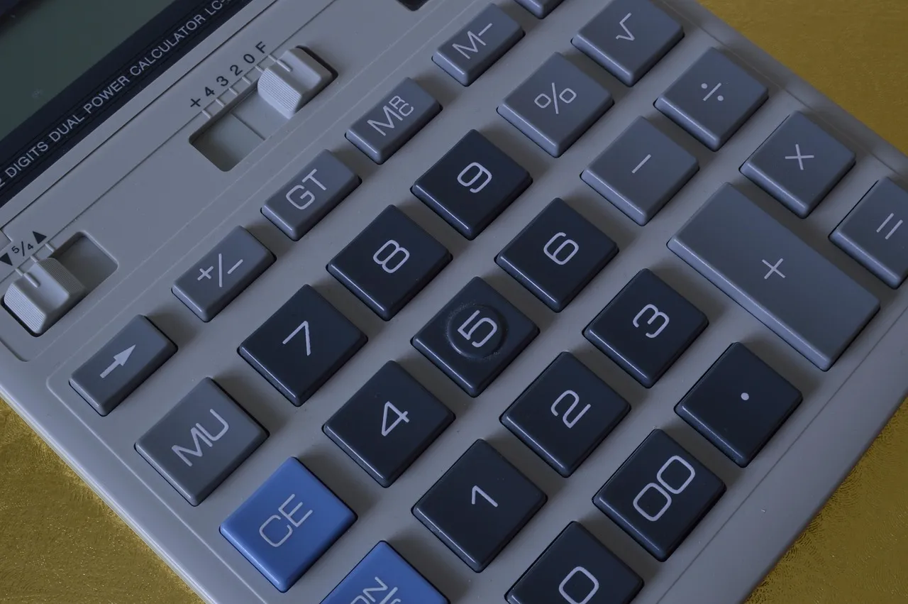 Photo showing calculator, calculation, keypad and finance.