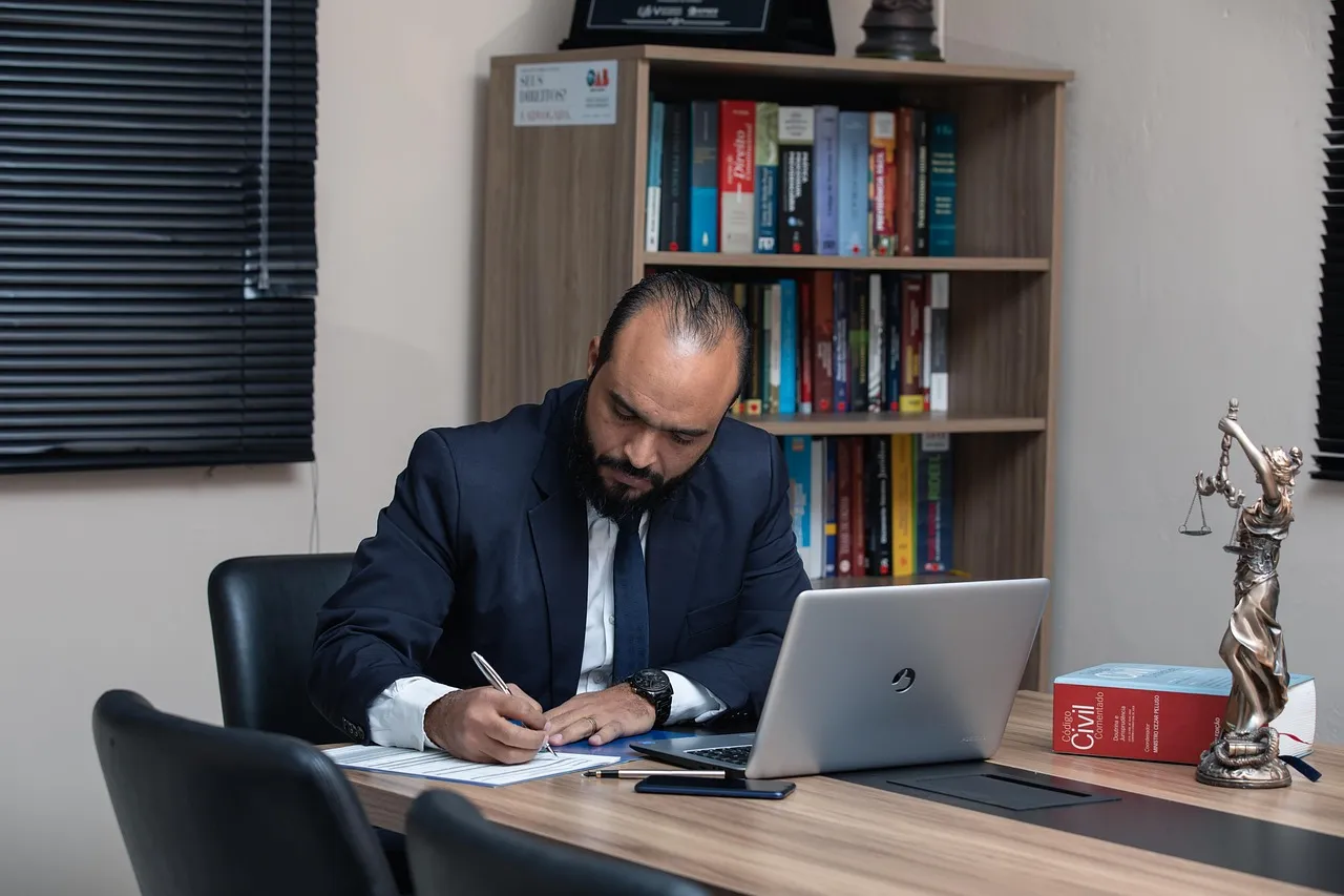 Photo showing man, lawyer, office and desk.
