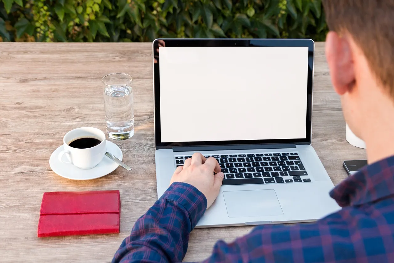 Photo showing laptop, workspace, notebook and work.