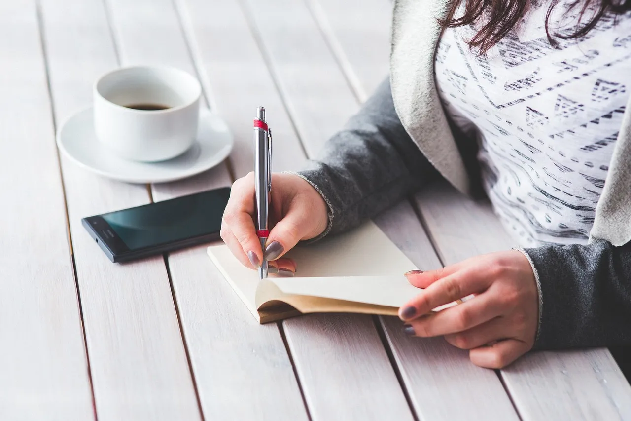 Photo showing woman, write, notepad and girl.