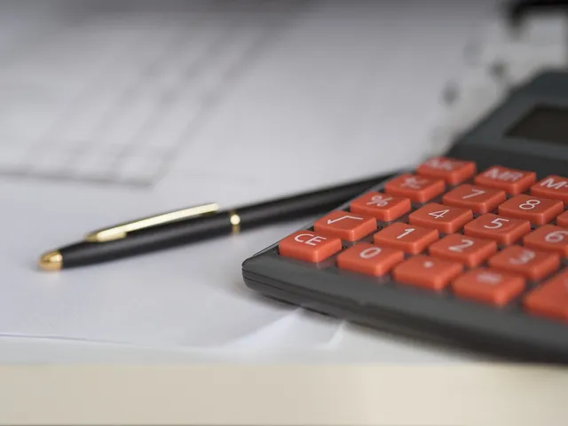Photo showing business, calculator and calculation.