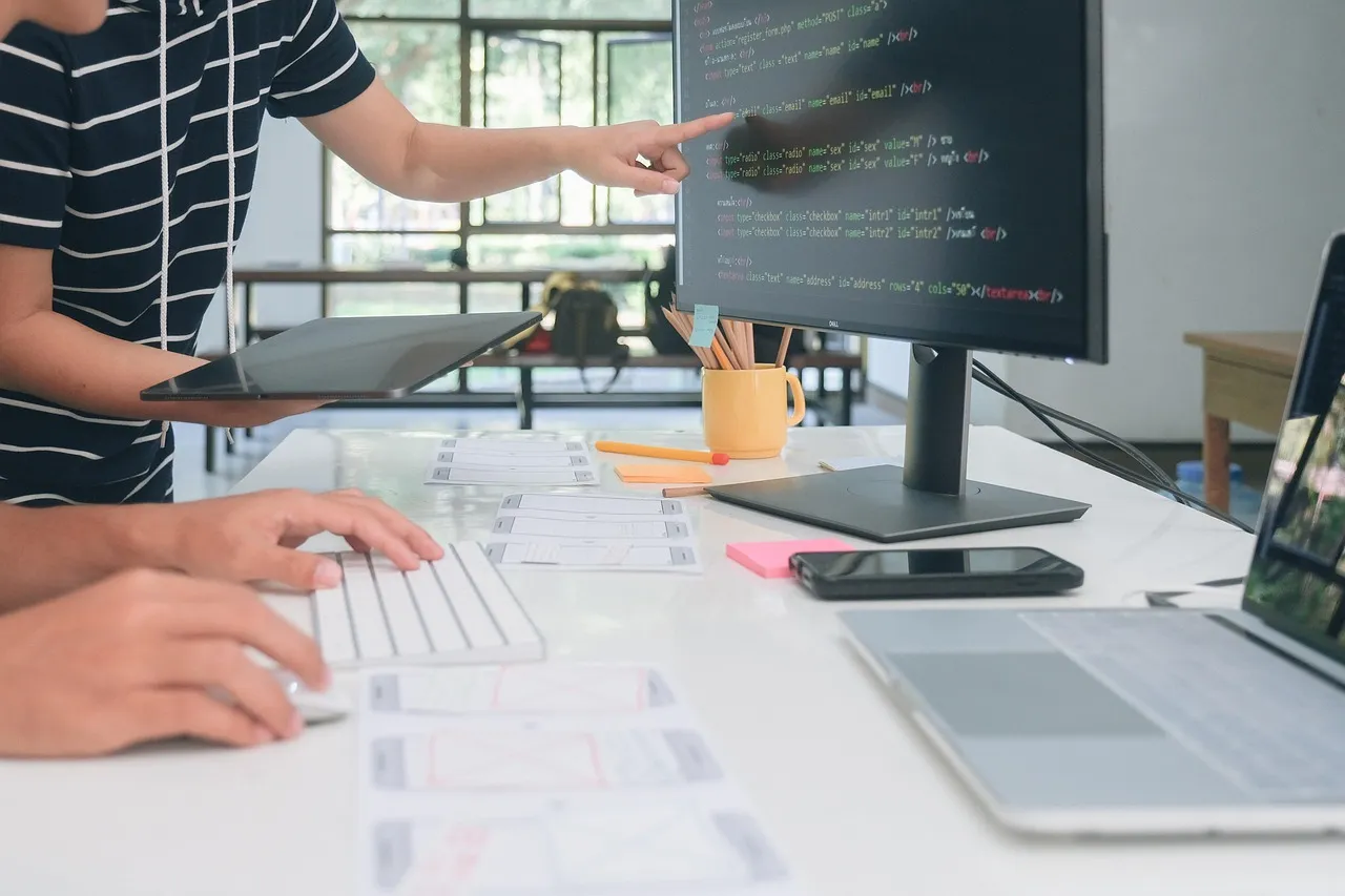 Photo showing website, web design, development and code.