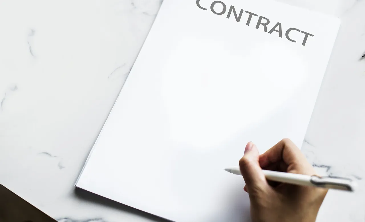 Photo showing contract, consultation, pen and ballpoint pen.