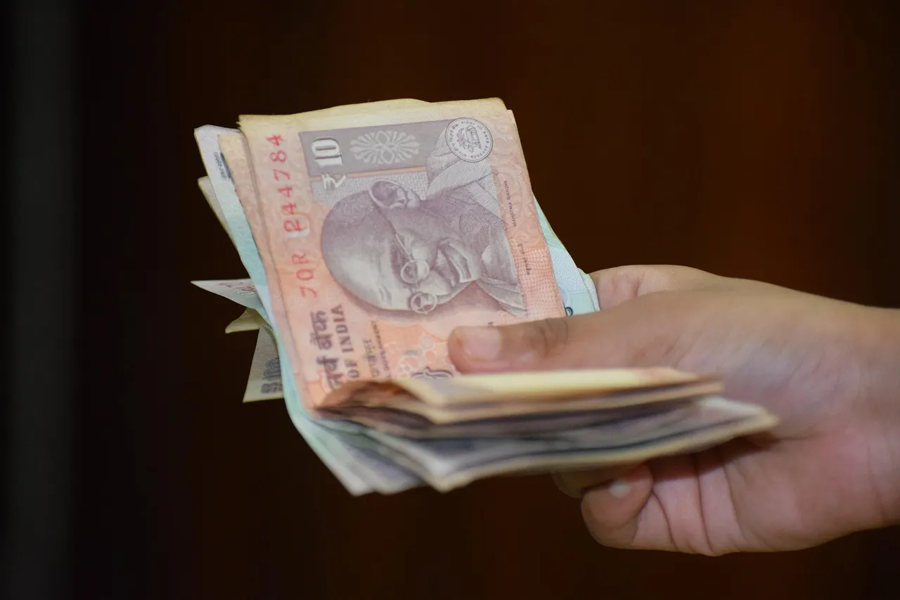 Photo showing gst, money and cash.