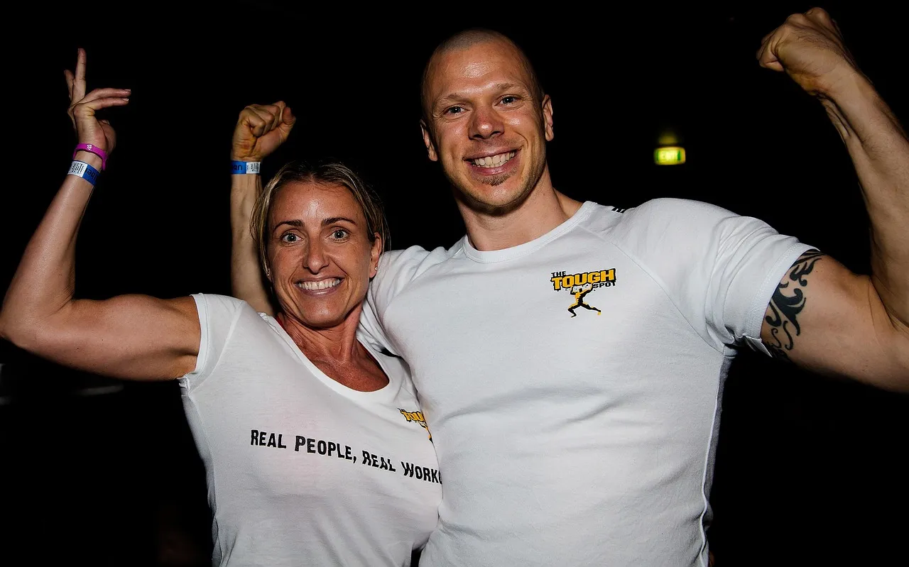 Photo showing couple, fit and personal trainers.