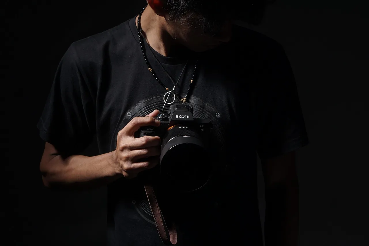 Photo showing camera, photographer, photography and profession.