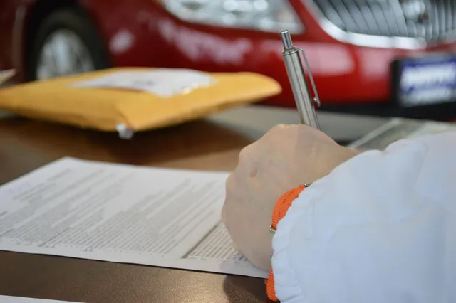 Photo showing contract, business and document.