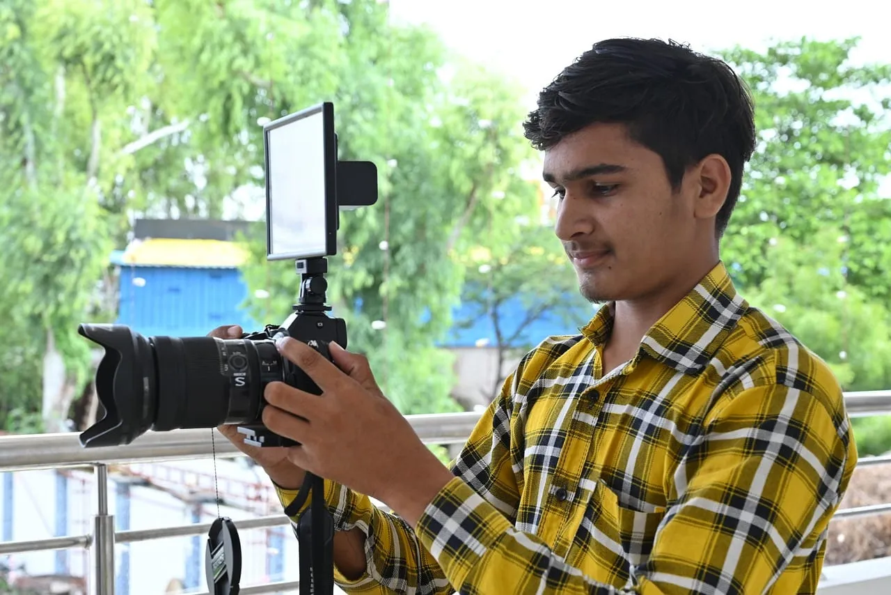 Photo showing man, videographer, video making and film making.