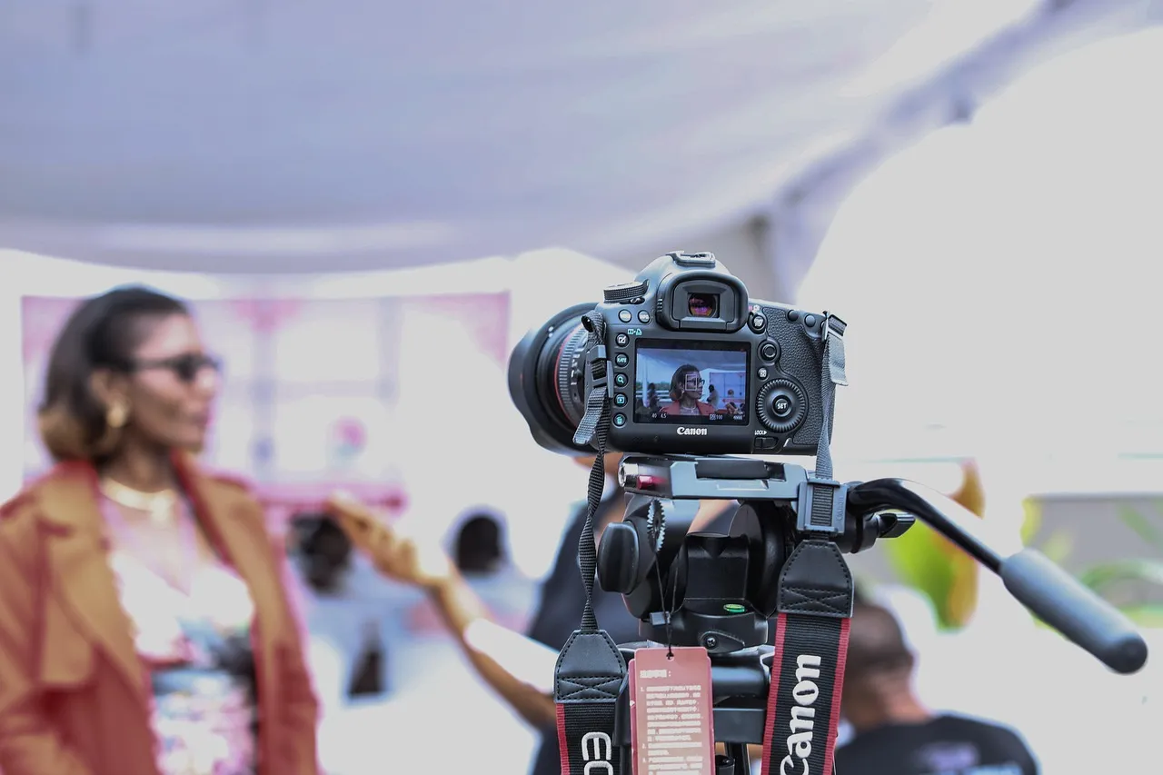 Photo showing camera, camera equipment and interview.