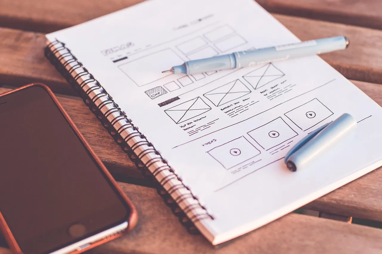 Photo showing plans, design and web design.