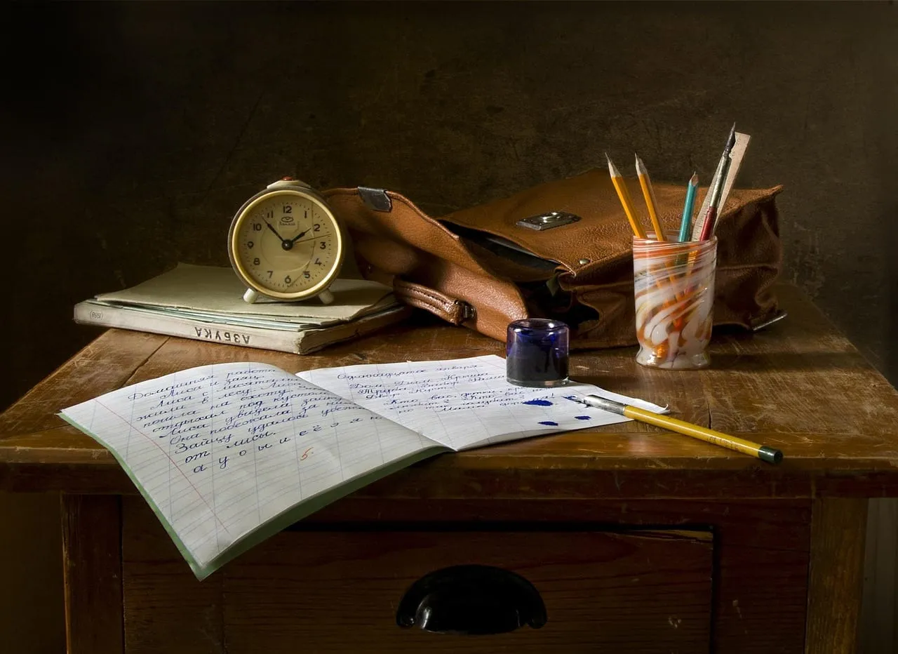 Photo showing school work, write, still life and assignment.